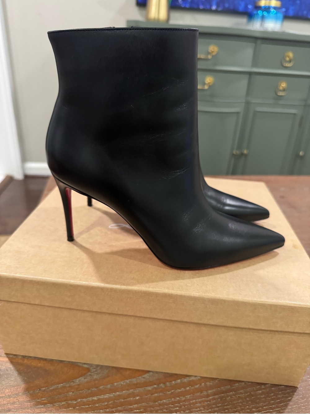 Christian Louboutin Black Leather Pointed Ankle Boot with Red Sole